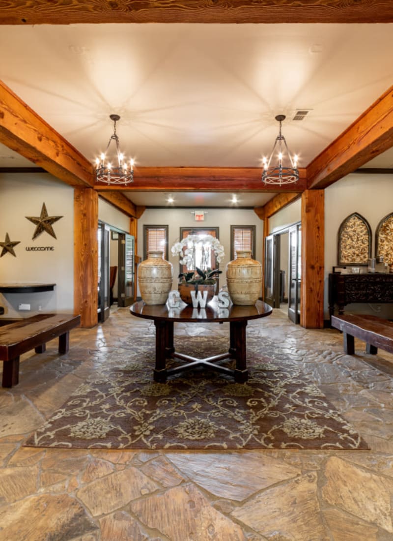 Rustic lobby entrance with benches at Marquis at Bellaire Ranch in Fort Worth, Texas