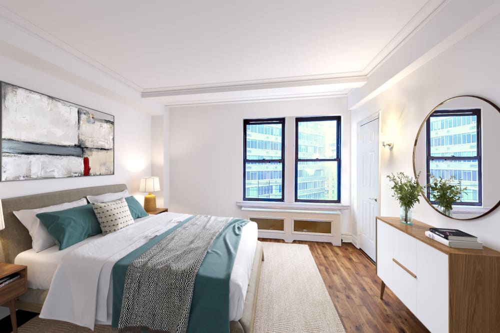 Large bedroom with wood-style flooring and a double window with a view at The Sutton Collection in New York, New York