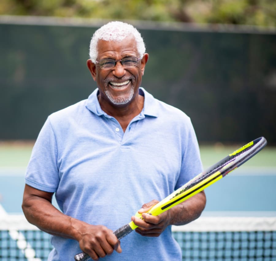 Resident playing tennis at Lakeview Senior Living in Lakewood, Colorado