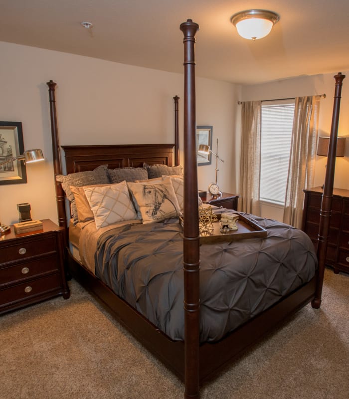 Spacious carpeted bedroom at Villas of Waterford Apartments in Wichita, Kansas