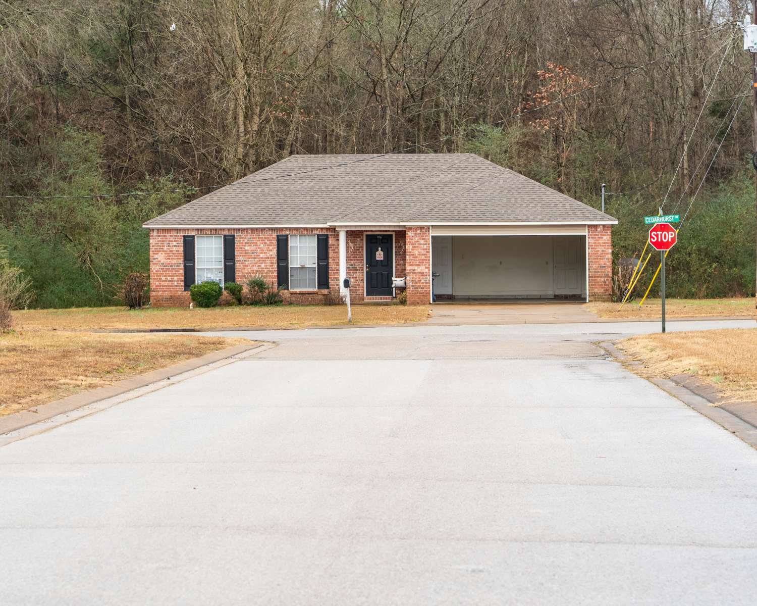 A wide road heading towards the apartment at Arrington Estates of Henderson in Henderson, Tennessee