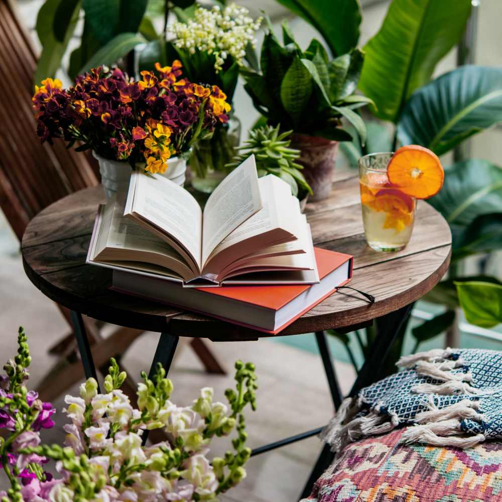 Books and drinks on a patio table at Mountain Brook Townhomes in Nashville, Tennessee