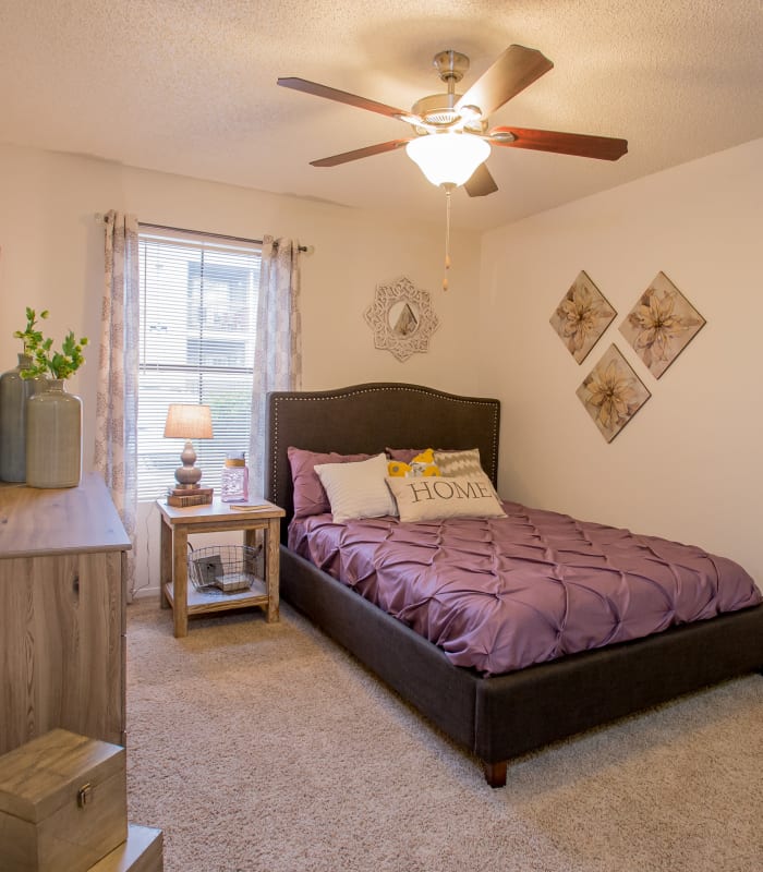 Spacious carpeted bedroom at Cimarron Pointe Apartments in Oklahoma City, Oklahoma