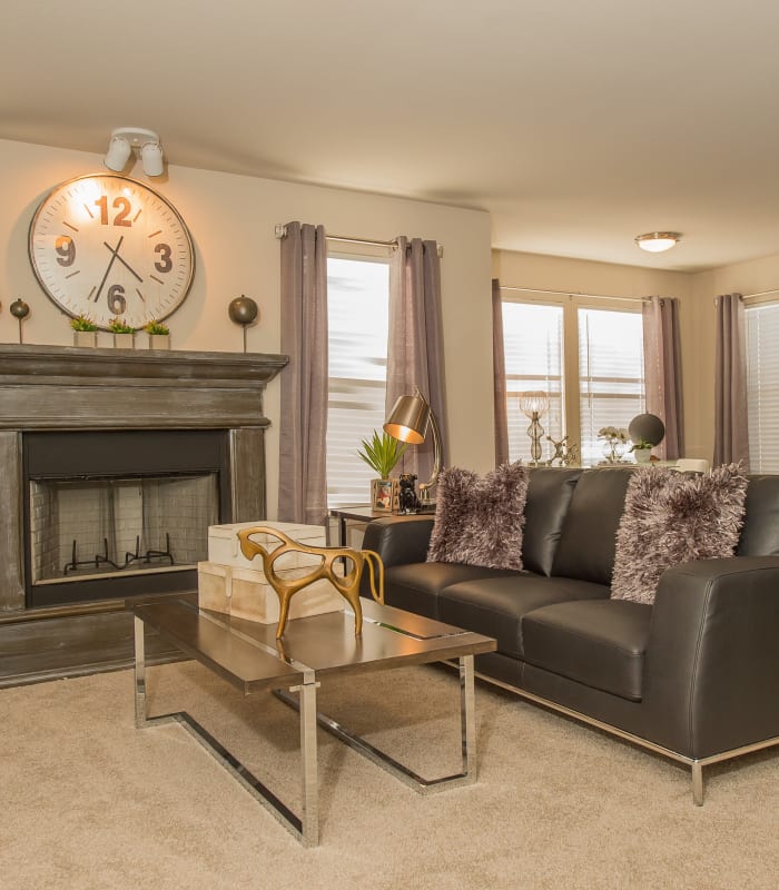 Spacious living room with large windows at Cottages at Tallgrass Point Apartments in Owasso, Oklahoma