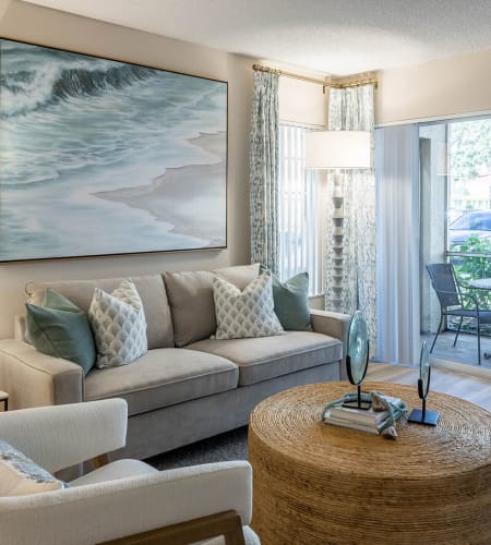 A furnished living room in a model apartment at Azalea Village in West Palm Beach, Florida