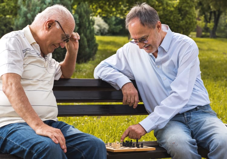 Residents of The Wellington play a game of chess together.