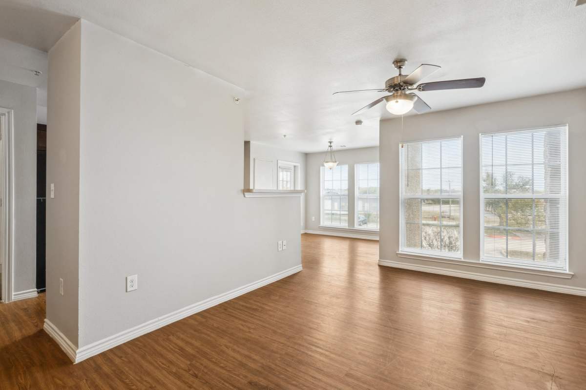 Apartment with wood flooring and large windows at Horizon Meadows in La Marque, Texas