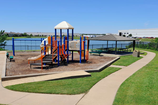 Playground overlooking lake at Crescent Cove at Lakepointe