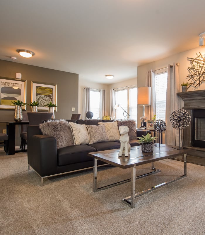 Carpeted living room at Scissortail Crossing Apartments in Broken Arrow, Oklahoma
