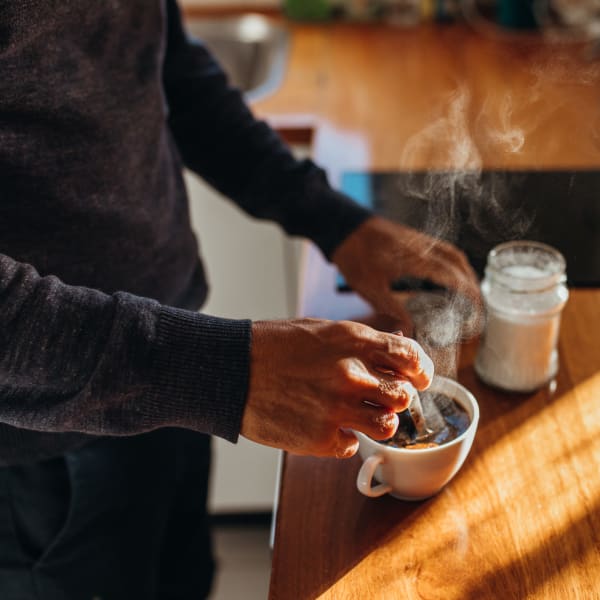 Resident getting a coffee at a café near The Mallory in Raleigh, North Carolina