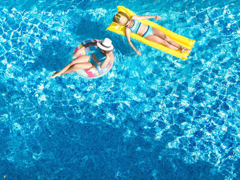 Two residents in the pool at Gramercy Scottsdale in Scottsdale, Arizona