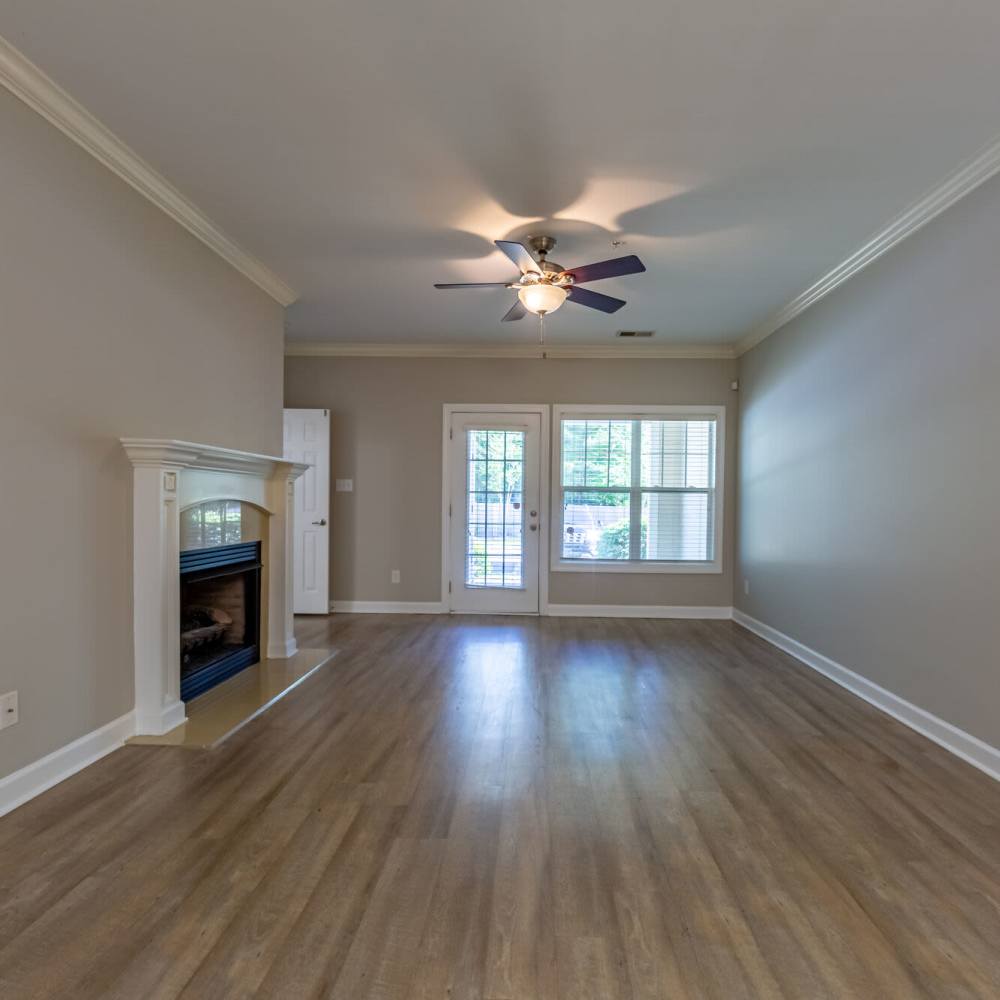Unfurnished living room with celling fan at Amelia Apartments in Fayetteville, North Carolina