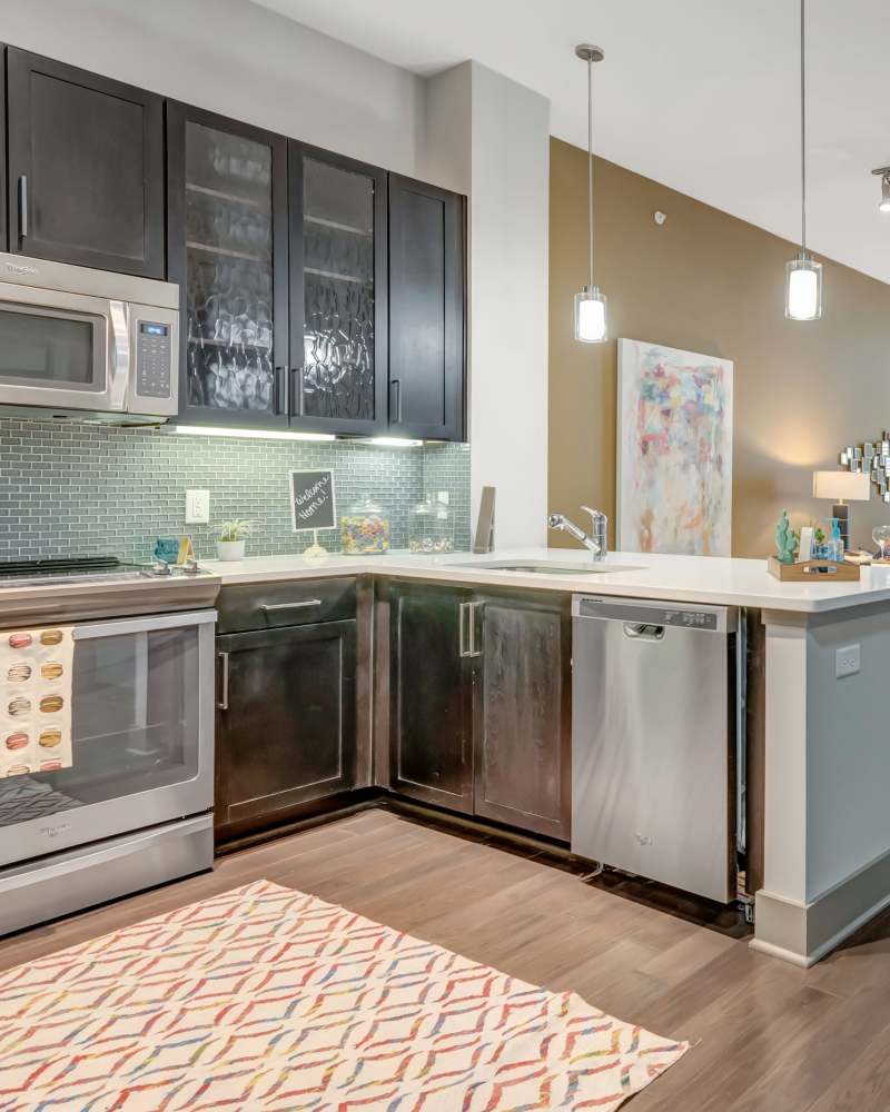 Kitchen Features Wooden Cabinetry at Anthem Cityline in Richardson, Texas