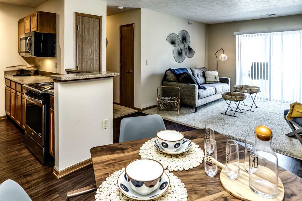 View of living room from dining area at The Falgrove Apartments in Omaha, Nebraska
