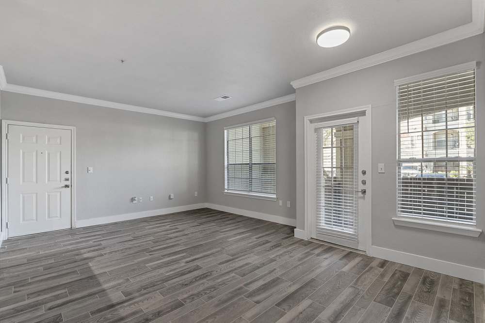 Unfurnished living room with wood-style flooring at Florence in Houston, Texas