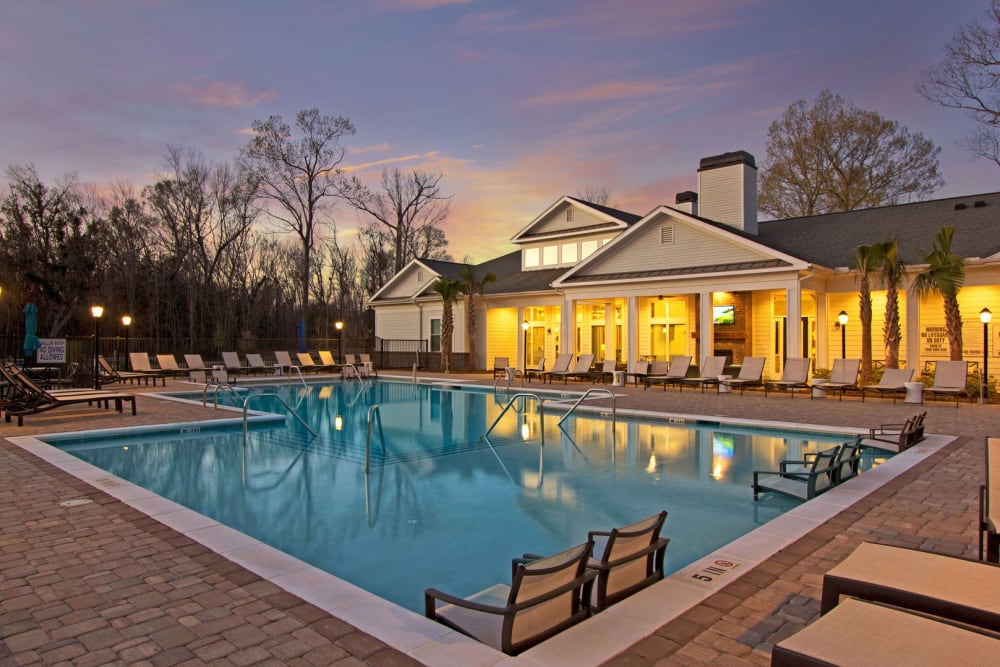 Swimming pool at sunset at Bluewater at Bolton's Landing in Charleston, South Carolina