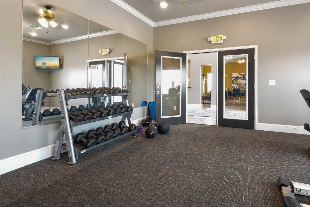 Free weights and mirrors in the fitness center at Pine Creek in Paris, Texas