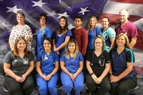 Group photo of the staff at Tall City Veterinary Hospital