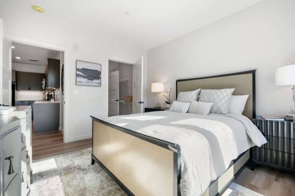 Well-furnished model home's bedroom at Anden in Weymouth, Massachusetts