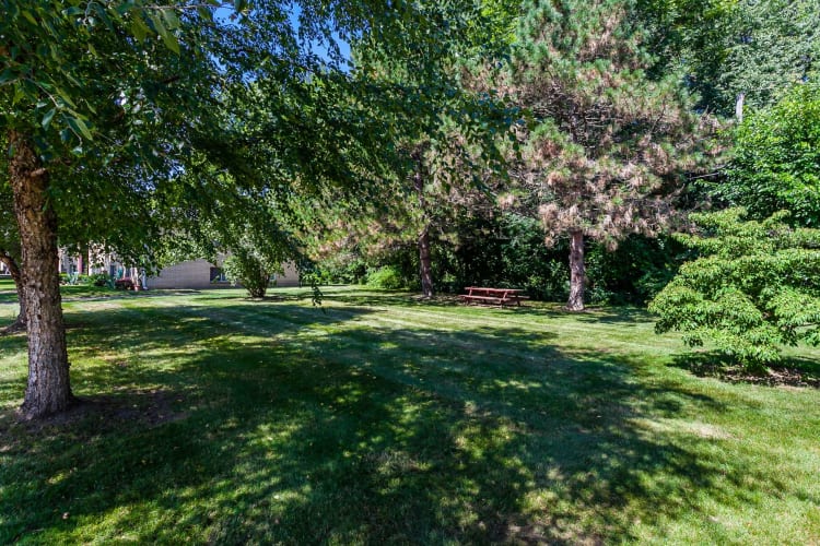 Lush grounds at Long Pond Gardens Senior Apartments in Rochester, New York