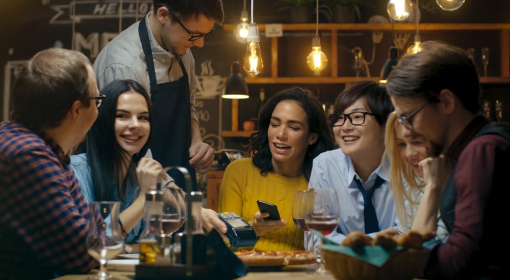 Friends gather for a bite to eat at their favorite spot near Fox Plan Apartments in Monroeville, Pennsylvania