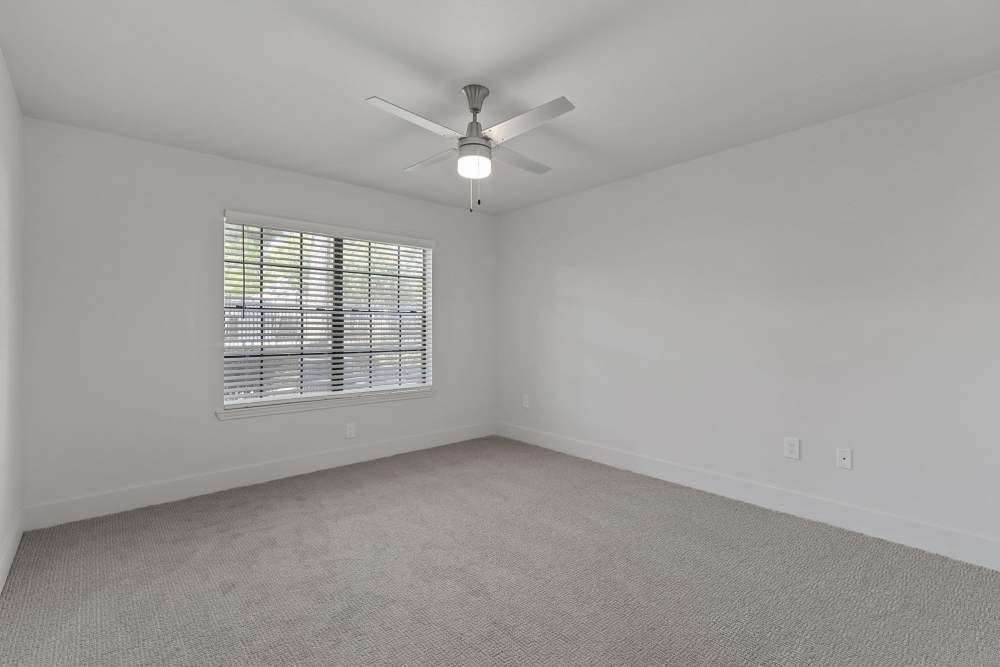 Bedroom with carpet flooring and ceiling fan at Seacrest in Katy, Texas
