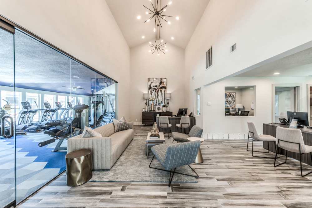 large resident lounge with couches, tables at Warwick at Westchase in Houston, Texas