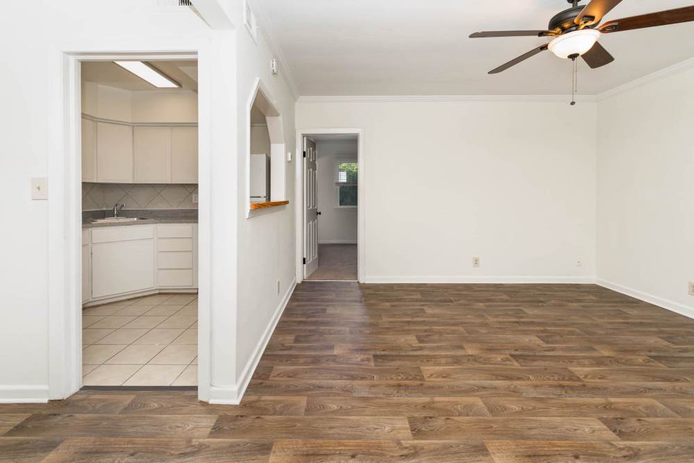 Unfurnished living room with ceiling fan and kitchen at Ocean View Living in Norfolk, Virginia