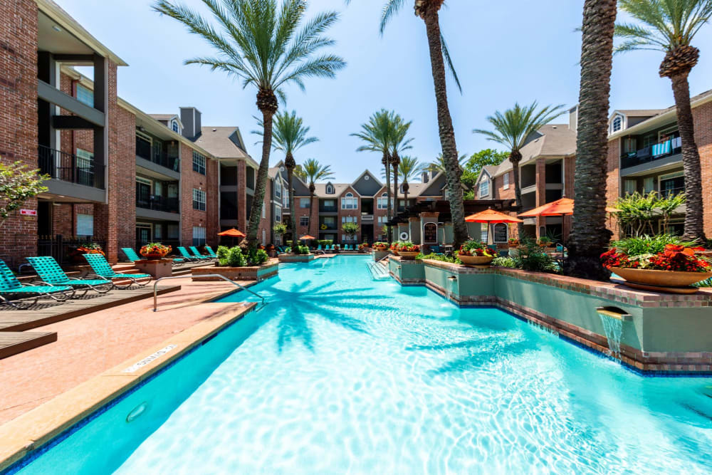 Sparkling pool nestled between units at Marquis on Pin Oak in Houston, Texas
