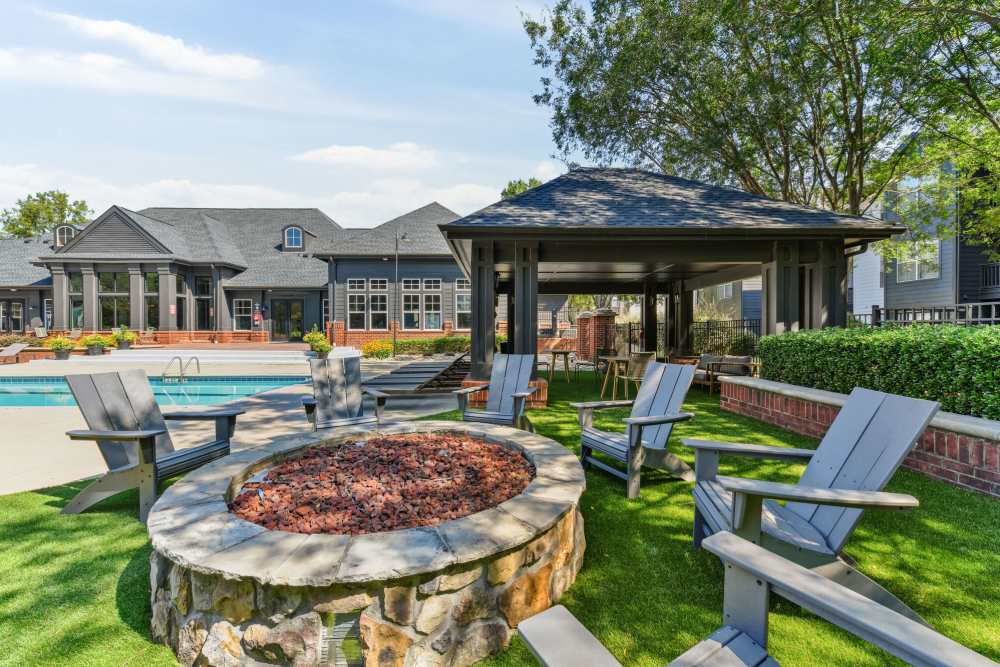 Exterior fireplace and a swimming pool at Wesley in Raleigh, North Carolina