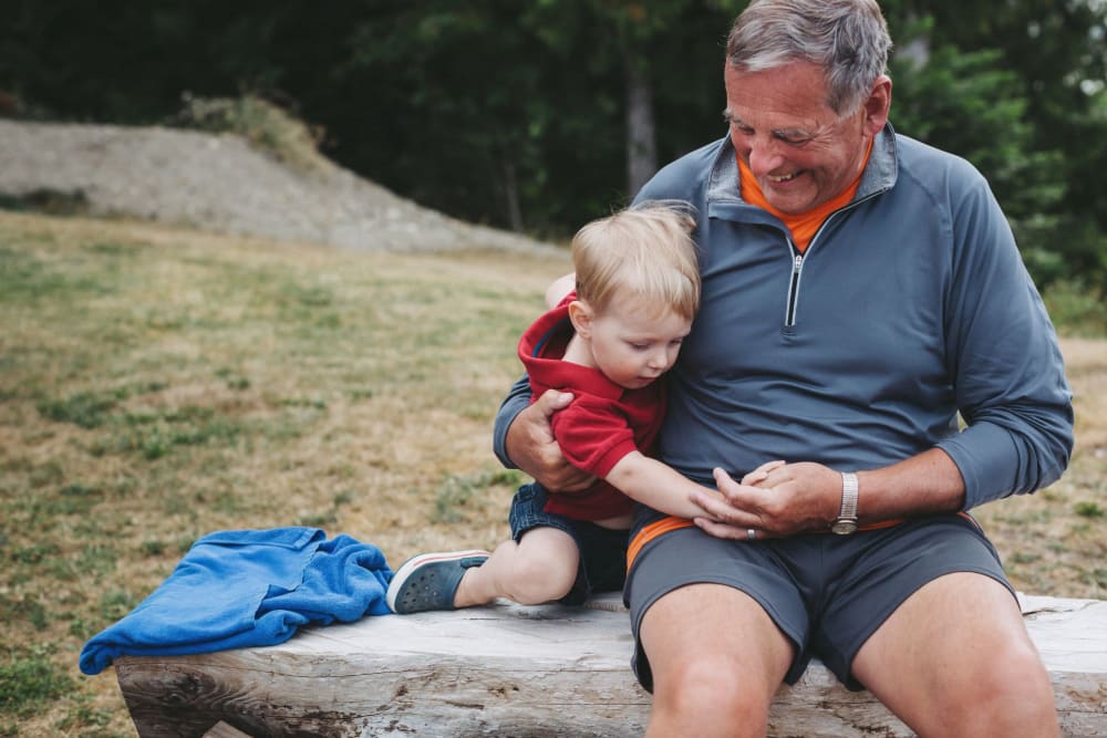 Father and son playing at park near Noble on the Lake in Brighton, Michigan