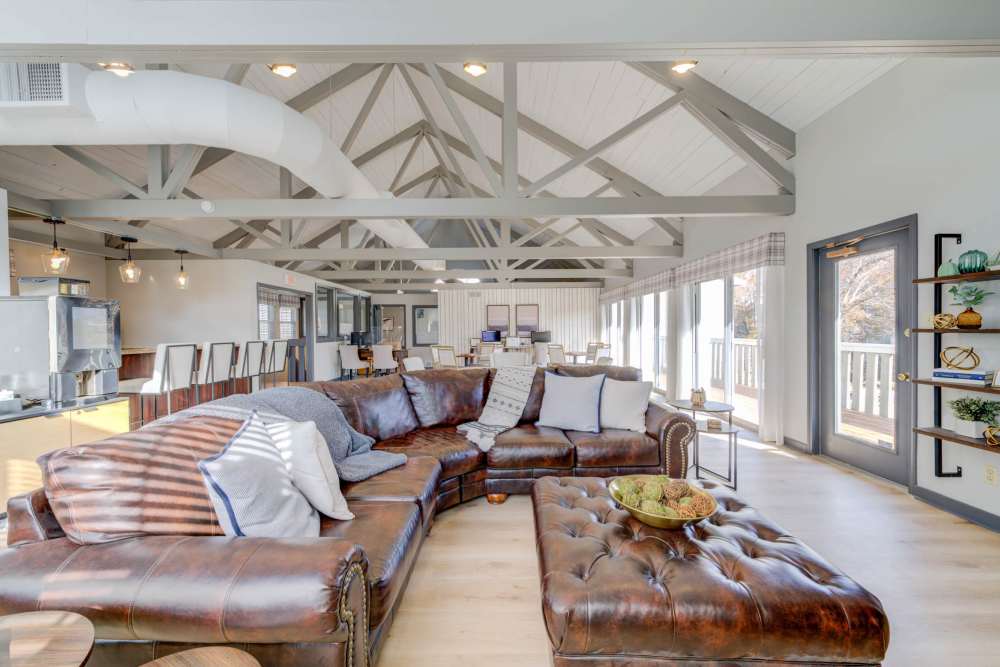 Spacious clubhouse with couch at Bonhomme Village in Olivette. MO