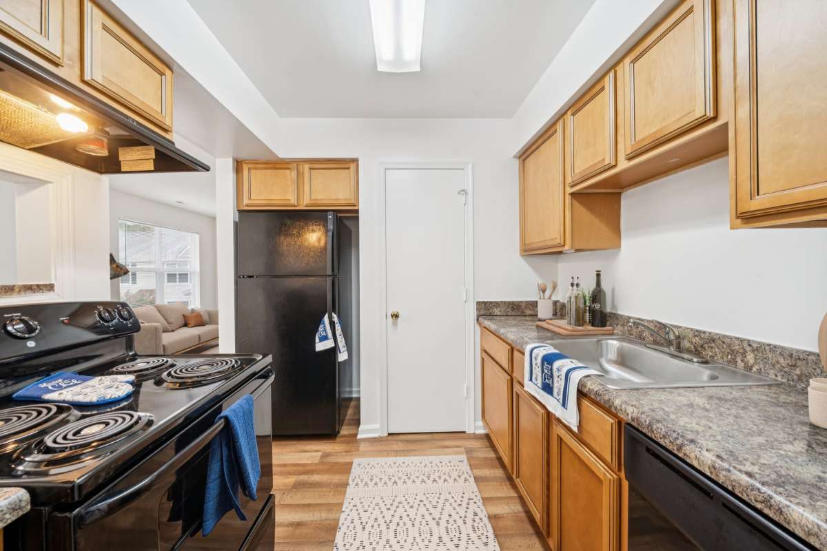 Kitchen with granite countertop at Maplewood in Chesapeake, Virginia