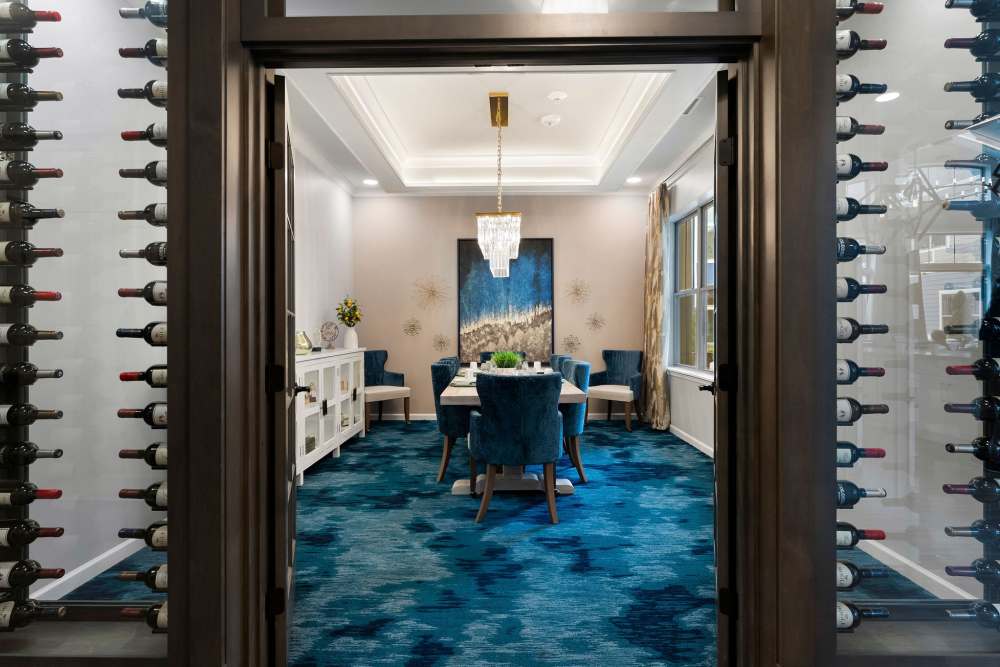 Dining area with large table and chairs at The Barclay at Whiskey Road in Aiken, South Carolina