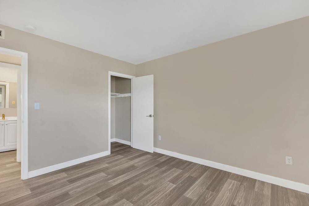 Spacious bedroom with connecting bathroom and large closets at /Bristol Square Apartments in Bristol, Tennessee