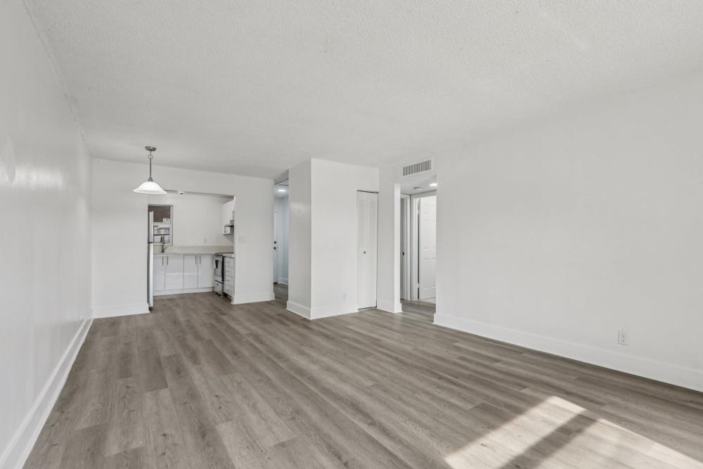 Well-lit apartment living space at El Jardin Apartments in Hollywood, Florida
