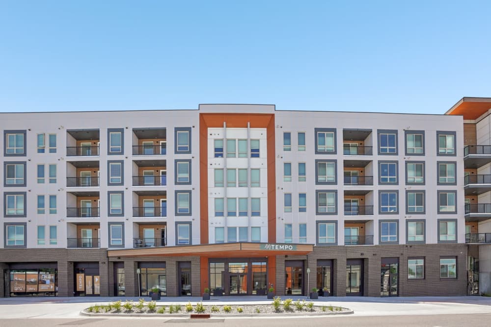 Modern five-story building with balconies at Tempo at Nine Mile Station in Aurora, Colorado