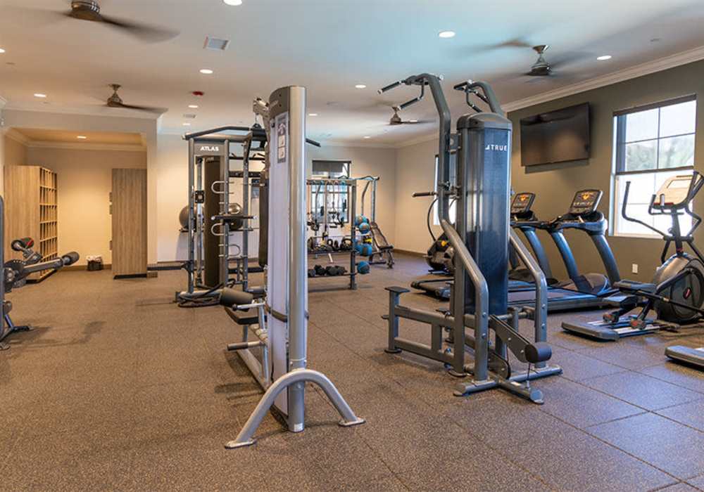 Fitness center with various equipment at The Courtyards Pacific Village in San Diego, California