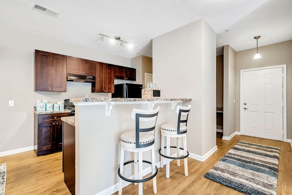Elegant kitchen with counter seating at Westshore Palms in Panama City, Florida