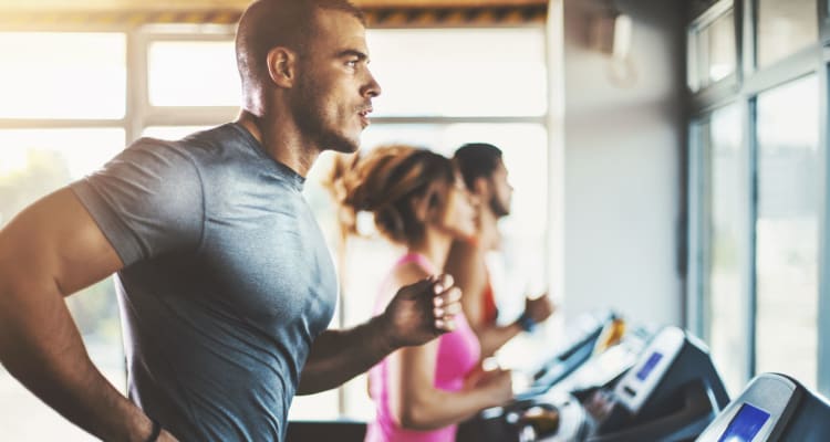 Resident getting in shape in the fitness center at Alexan Park West in Peoria, Arizona