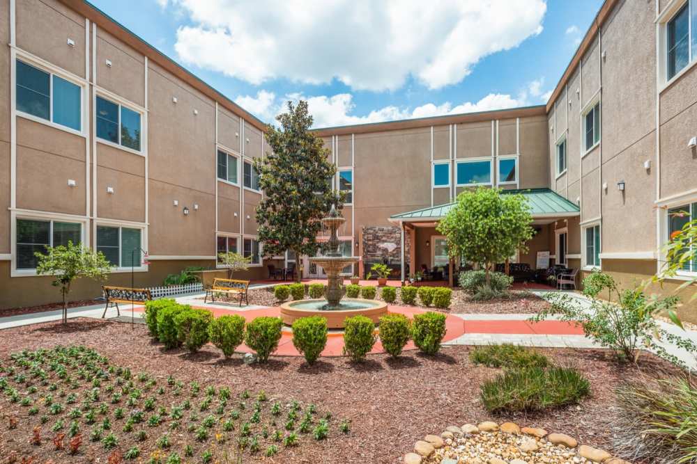 Community garden and seating area at Grand Villa of Ocala in Ocala, Florida