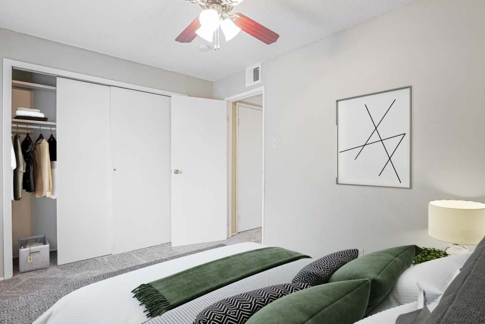 Bedroom with walk-in closet at Courtyard Apartments in Columbia,Missouri