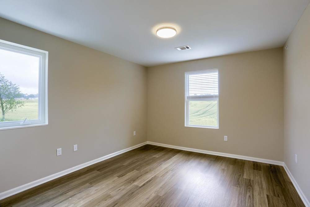 Spacious and well-lit bedroom with ceiling fan at Normandy Lofts in Shippensburg, Pennsylvania