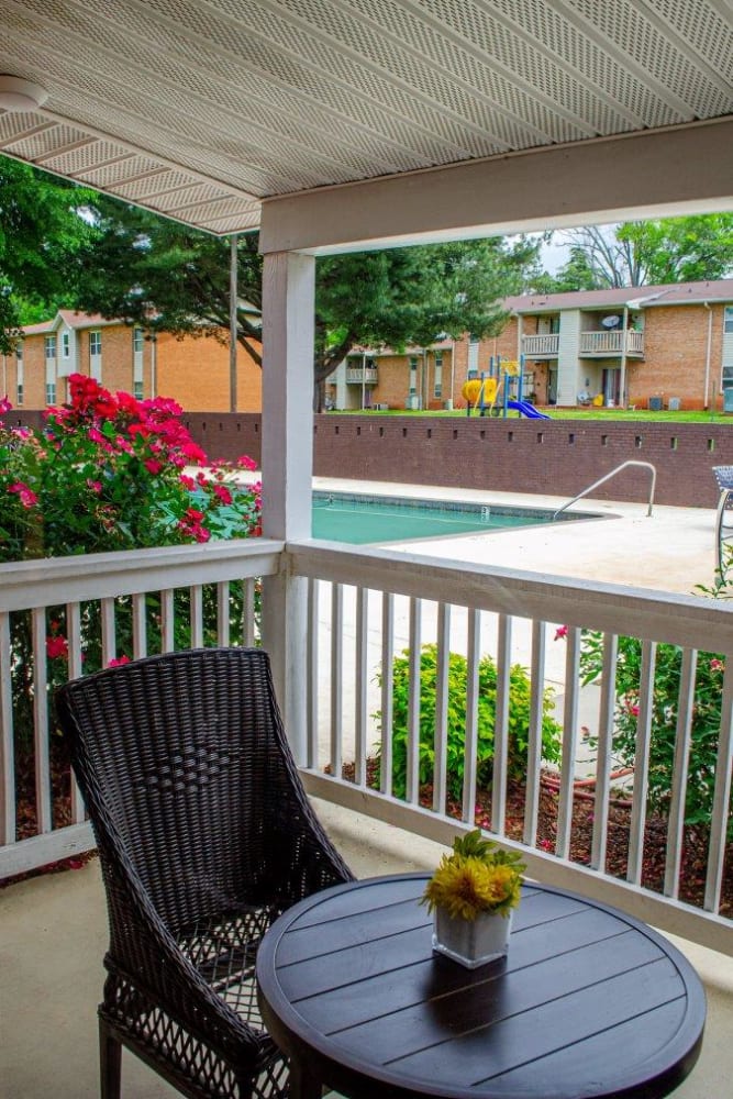 A table and chair on a patio at Vista Villa in Charlotte, North Carolina