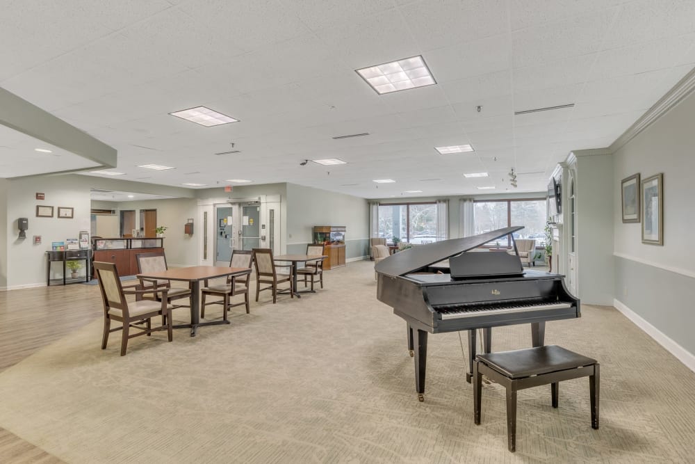 Community room with piano at Truewood by Merrill, Modesto in Modesto, California.