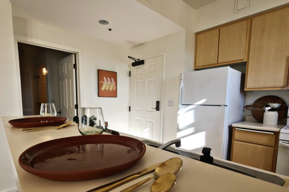 Kitchen with white appliances at Oak Grove at Dublin Ranch in Dublin, California