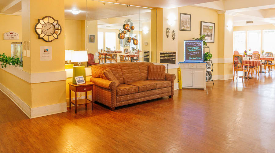 Assisted living resident chatting with the community director at Peoples Senior Living in Tacoma, Washington