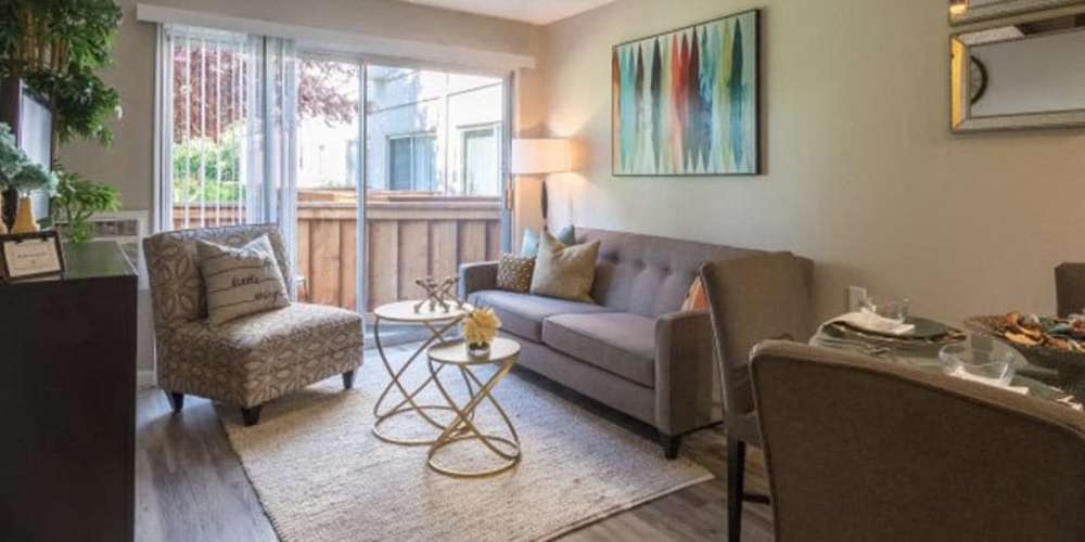 Model apartment living room opening onto a private patio at Parc Station in Santa Rosa, California