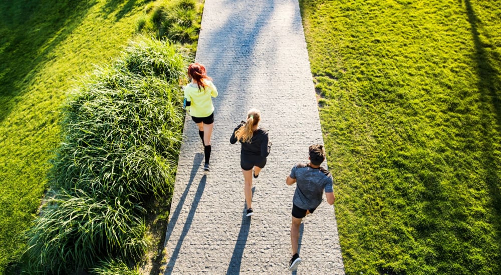 Residents go for a run together at a park near Hamilton Place in Pittsburgh, Pennsylvania