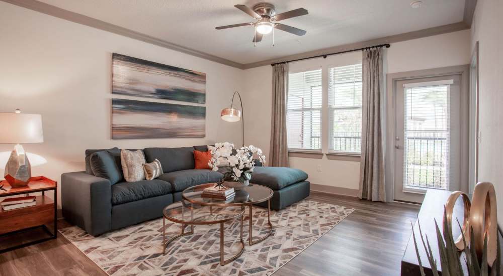 Leather couch in a model home's living space at Glades at Gulf View in Port Richey, Florida